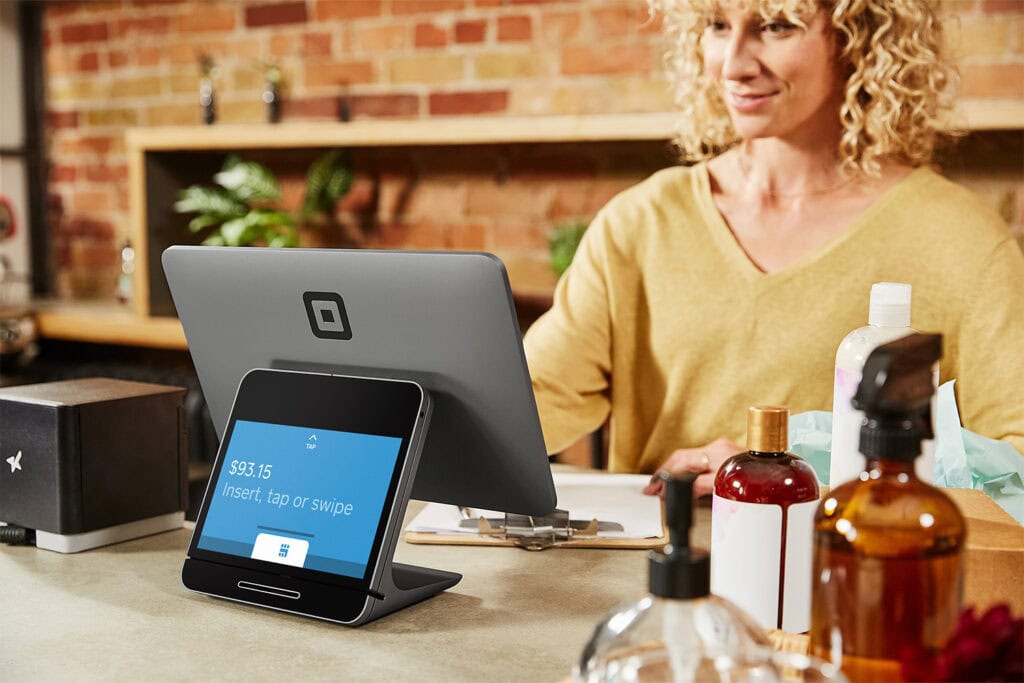 Image of a Business Owner Square Register and Merchant At Counter